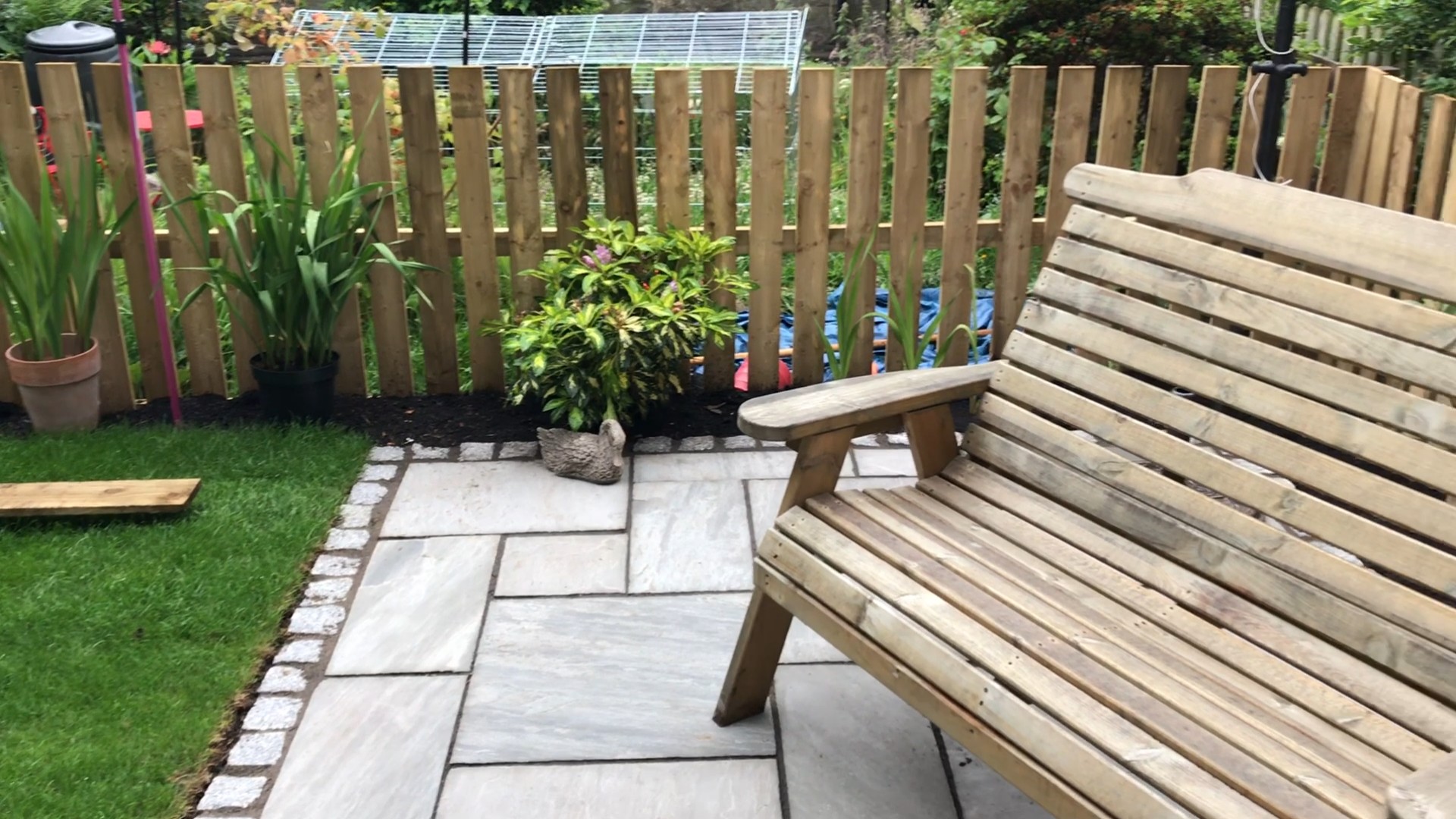 garden patio with stone bench image